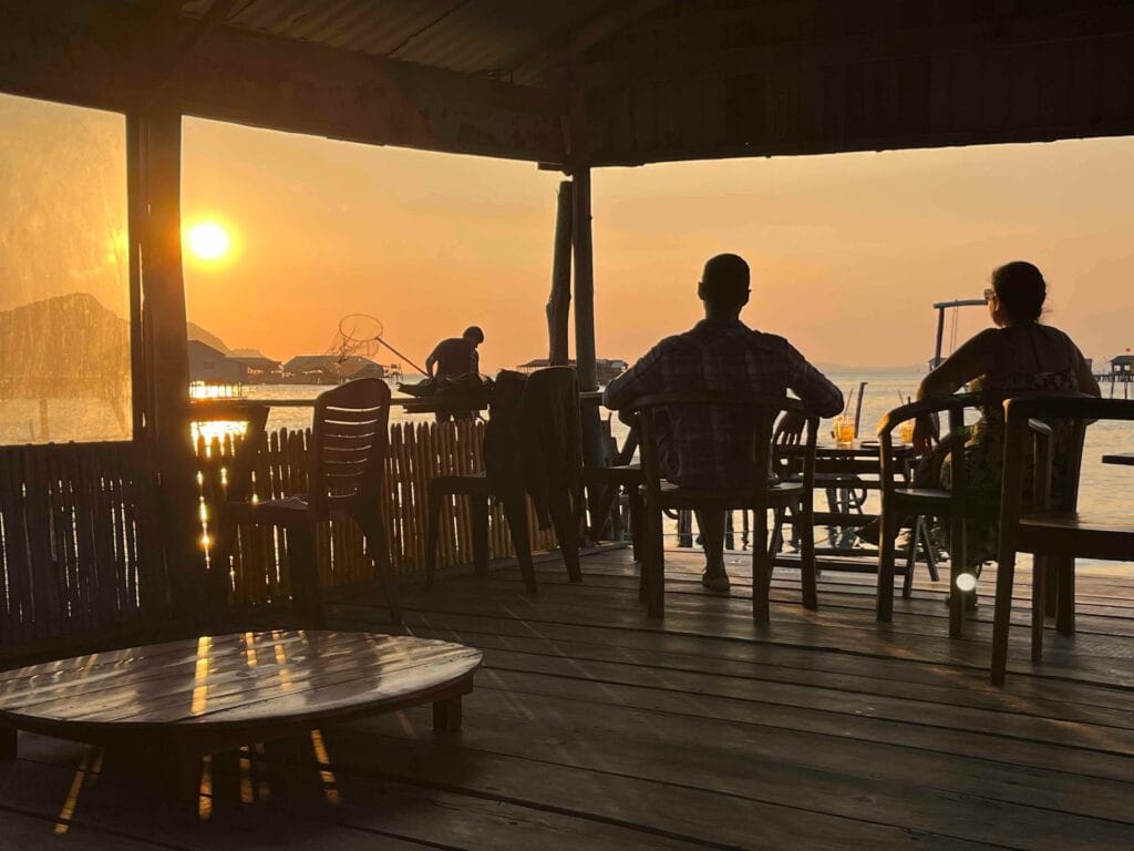 Two people enjoying the sunset