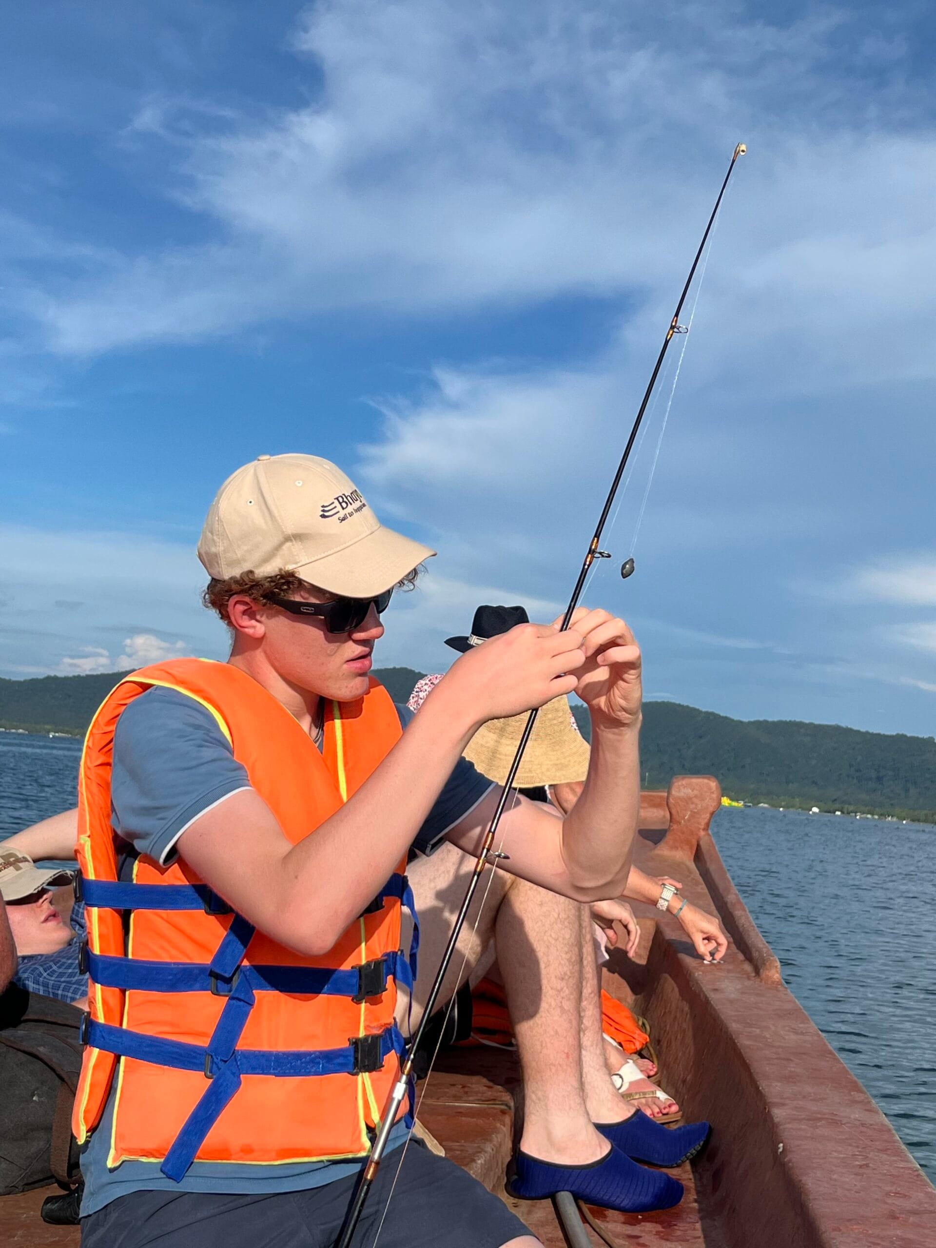 Guy fixing a fishing rod