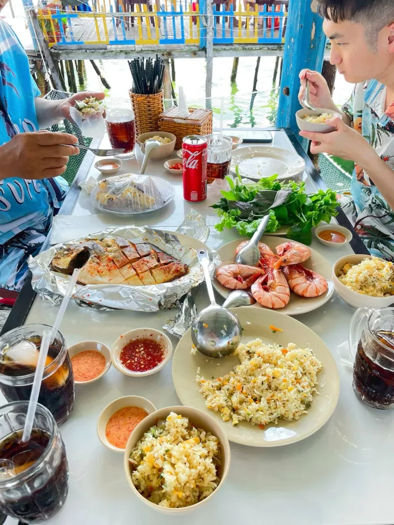 A table full of seafood in floating restaurant, rach vem, phu quoc